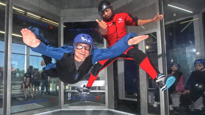 Two people flyign at iFLY - indoor skydiving UK